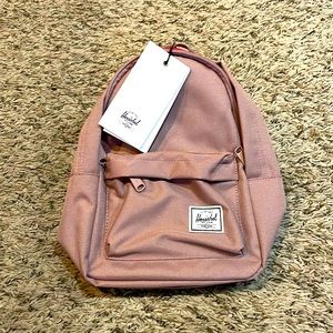 Never used sod Pink Mini Herschel backpack.